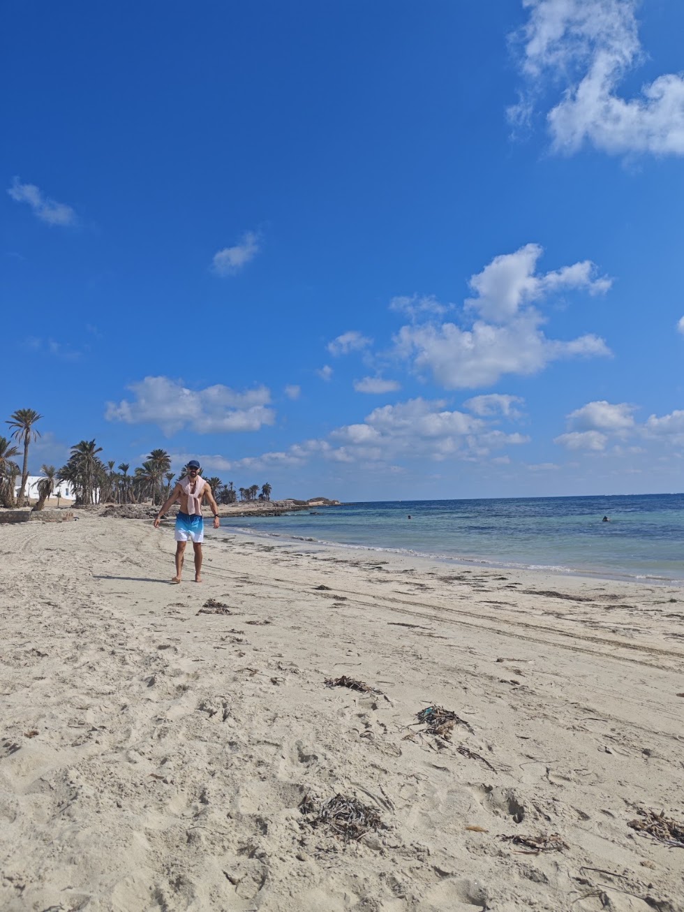 Yacopo restoring energy with movement beside the sea